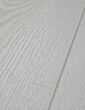 Close-up of Toscolano Oak White laminate floor texture.